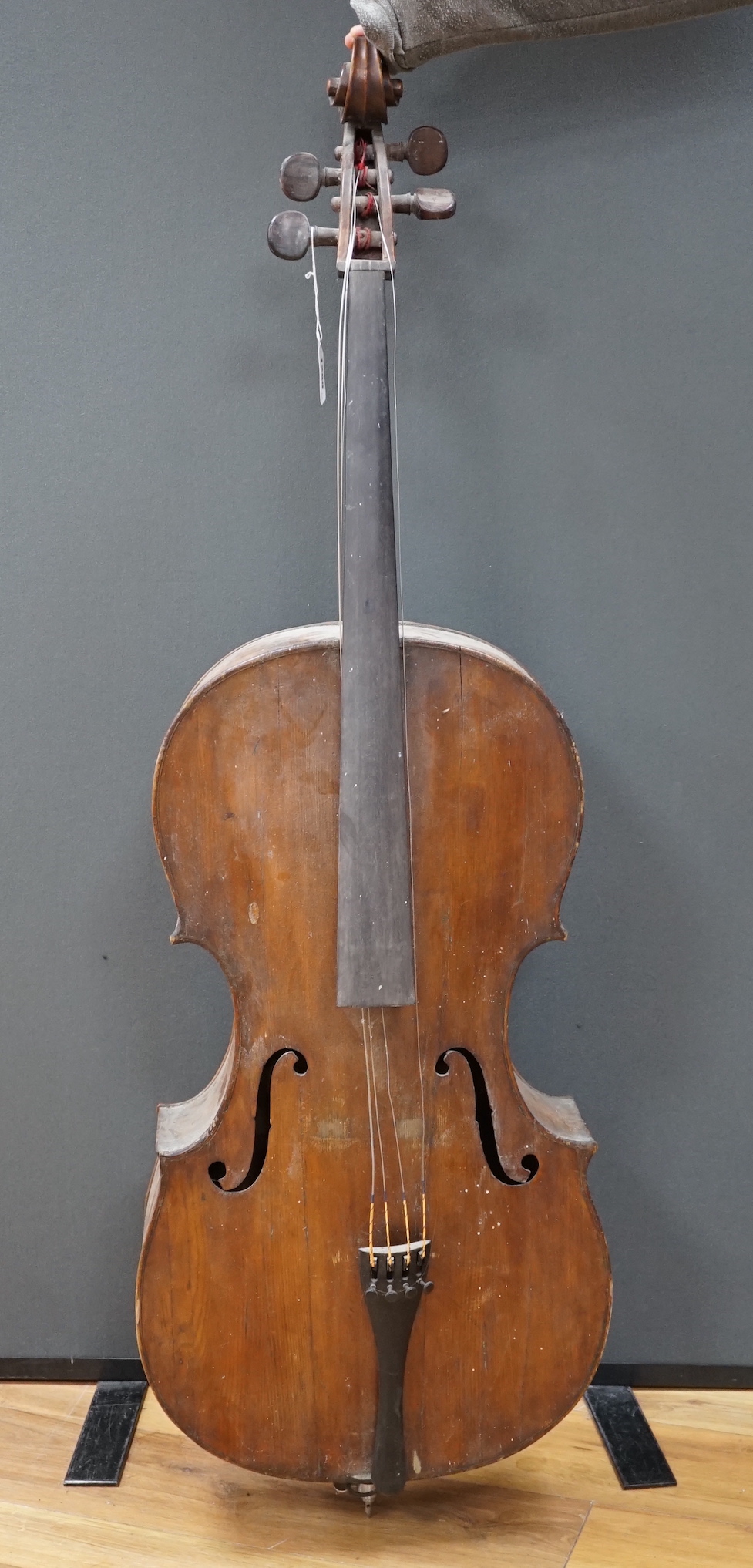 An early 20th century cello for restoration, indistinct internal label; ‘Restored by William J. Acton, Green Street, Forest Gate, London 1910’ length of body 72cm.